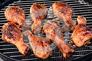 BBQ Chicken Legs Roasted On Hot Charcoal Grill