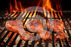 BBQ Chicken Legs Roasted On Hot Charcoal Grill photo