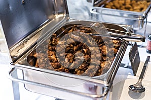 BBQ Chicken wings and nuggets with spicy sauce during a business meeting buffet