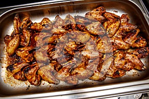 BBQ Chicken wings with spicy sauce on a tray