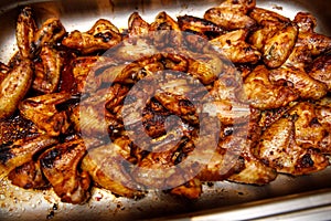 BBQ Chicken wings with spicy sauce on a tray