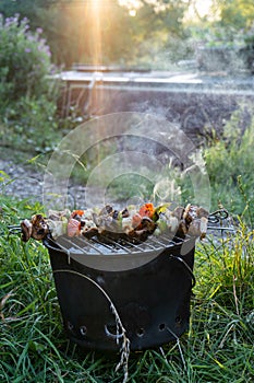 BBQ at dusk next to narrowboat