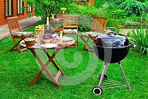 BBQ Family Party Scene In Decorative Garden On The Backyard