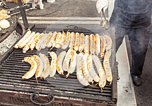 BBQ with fiery sausages on the grill