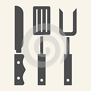 BBQ grill cutlery solid icon. Roasting utensil symbol, glyph style pictogram on beige background. Butcher knives, fork
