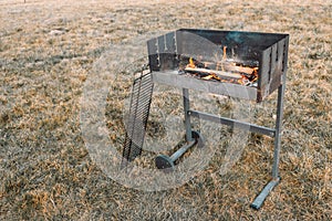 bbq grill flame, hot burning grill, outdoors cooking food. Grill flame burning fire for barbecue cooking outdoors.