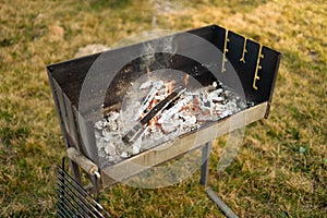 bbq grill flame, hot burning grill, outdoors cooking food. Grill flame burning fire for barbecue cooking outdoors.