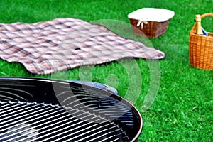 BBQ Grill,Picnic Basket With Wine, Blanket On The Lawn