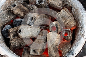 BBQ Grill Pit With Glowing And Flaming Hot Charcoal Briquettes,