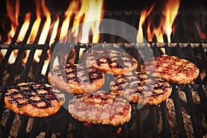 BBQ Grilled Burgers Patties On The Hot Flaming Grill photo