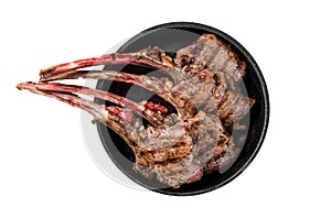 BBq Grilled lamb mutton chops steaks in a pan. Isolated, white background. Top view.