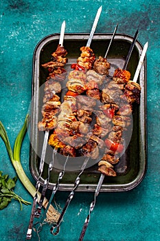 Bbq grilled meat pork, chicken and vegetable skewers on tray. Top view, flat lay