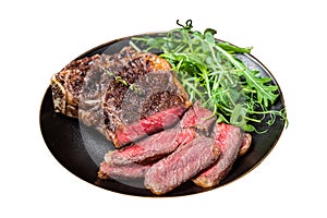 BBQ Grilled Wagyu New York beef meat steak or Striploin steak in a plate with salad. Isolated on white background. Top