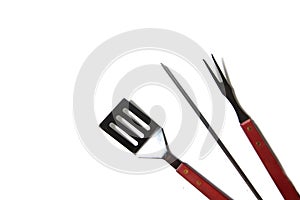 BBQ instruments kit - skewer, spatula, fork - close up isolated on white background flat lay
