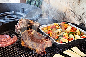 BBQ outside with T-Bone Steak and vegetables