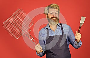 Bbq party. Culinary concept. summer weekend. happy hipster hold cooking utensils for barbecue. bearded man chef. Tools