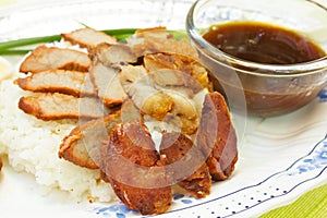 BBQ Pork, sausage, crispy pork over rice.