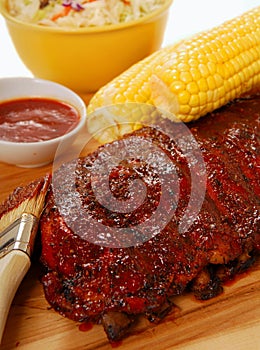 BBQ Ribs with cole slaw, corn and dipping sauce photo