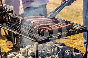 BBQ sausage on an open coal fire grill