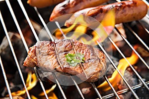 BBQ sausages and meat on the grill.