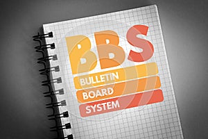 BBS - Bulletin Board System acronym on notepad, technology concept background