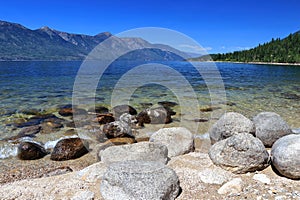 Kootenay Lake Beach with Darkwoods Conservation Area near Creston in the Background, Interior British Columbia, Canada photo