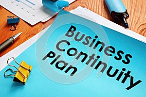 BCP Business Continuity Plan and stack of papers