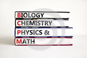 BCPM biology chemistry physics math symbol. Concept words BCPM biology chemistry physics math on books on beautiful white