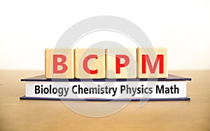BCPM biology chemistry physics math symbol. Concept words BCPM biology chemistry physics math on wooden blocks on beautiful white