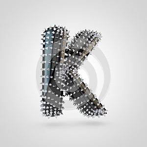 BDSM black latex letter K uppercase with chrome spikes isolated on white background