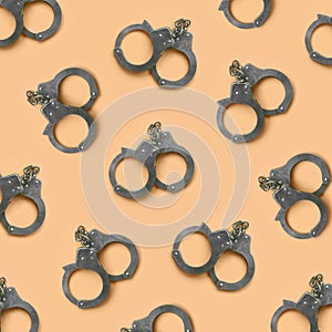Bdsm and sex games concept. Many handcuffs on cream background