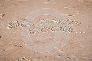 `Be Back Soon` Written in the Sand