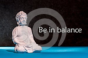 Be in Balance - motivation for balancing between life, work, family, sport and yoga. Meditating Buddha