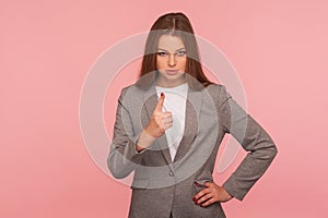 Be careful, caution! Portrait of strict displeased lady boss in business suit making admonishing hand gesture