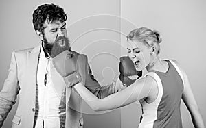 Be careful. problems in relationship. sport. bearded man hipster fighting with woman. knockout punching. who is right
