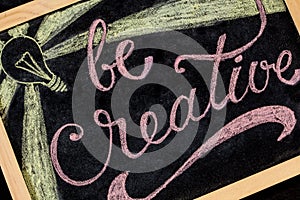Be Creatvie - colorful chalk lettering motivational quote closeup.