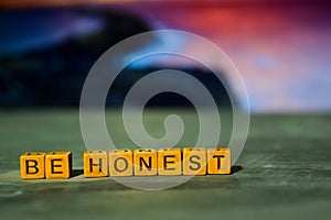 Be honest on wooden blocks. Cross processed image with bokeh background