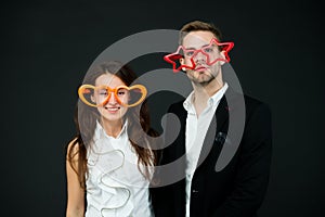 Be my Valentine. Happy couple dark background. Couple in love. Sensual couple wear party glasses. Couple of sexy woman