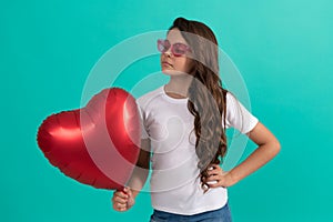 be my valentine. teen girl with party balloon. love present. serious kid with love romantic gift