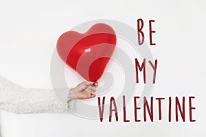 Be my valentine text sign. happy valentine`s day concept. hand h