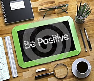 Be Positive Concept on Small Chalkboard. 3D.