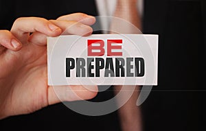 BE PREPARED, message on business card shown by a businessman. Business startup risks management concept