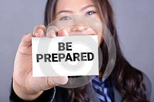 BE PREPARED, message shown by a businesswoman photo