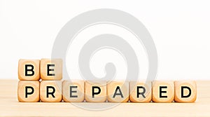 Be prepared phrase in wooden blocks on table. Copy space photo