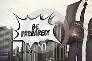 Be prepared text with businessman wearing boxing