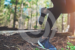 Be proud of every step you take. an unrecognizable young woman out for a jog in the woods.
