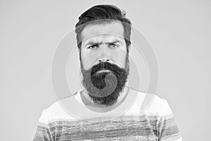Be serious. Hipster appearance. Beard fashion and barber concept. Man bearded hipster stylish beard and mustache yellow