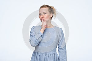 Be silent, it is secret. Female asks to keep secret information confidential