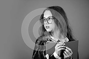 Be smarty. Smart girl brown background. Little girl back to school. Small girl read book in glasses. Primary school girl