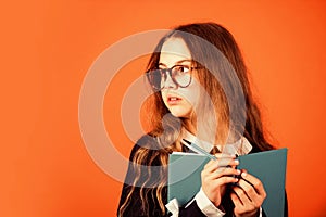 Be smarty. Smart girl brown background. Little girl back to school. Small girl read book in glasses. Primary school girl